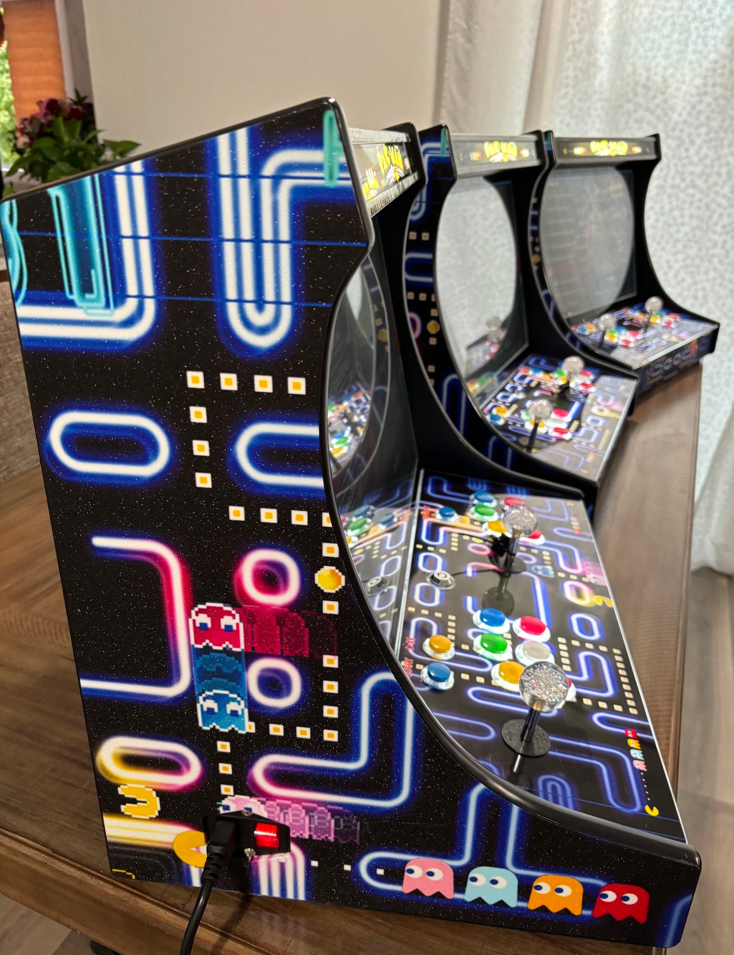 Three CherryQuest 22-inch tabletop arcade machines showing illuminated side artwork